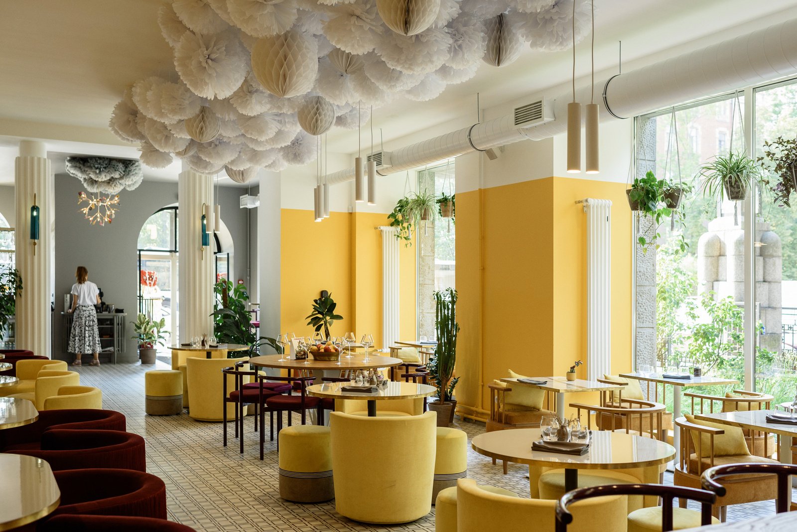 Interior of stylish contemporary restaurant with big windows